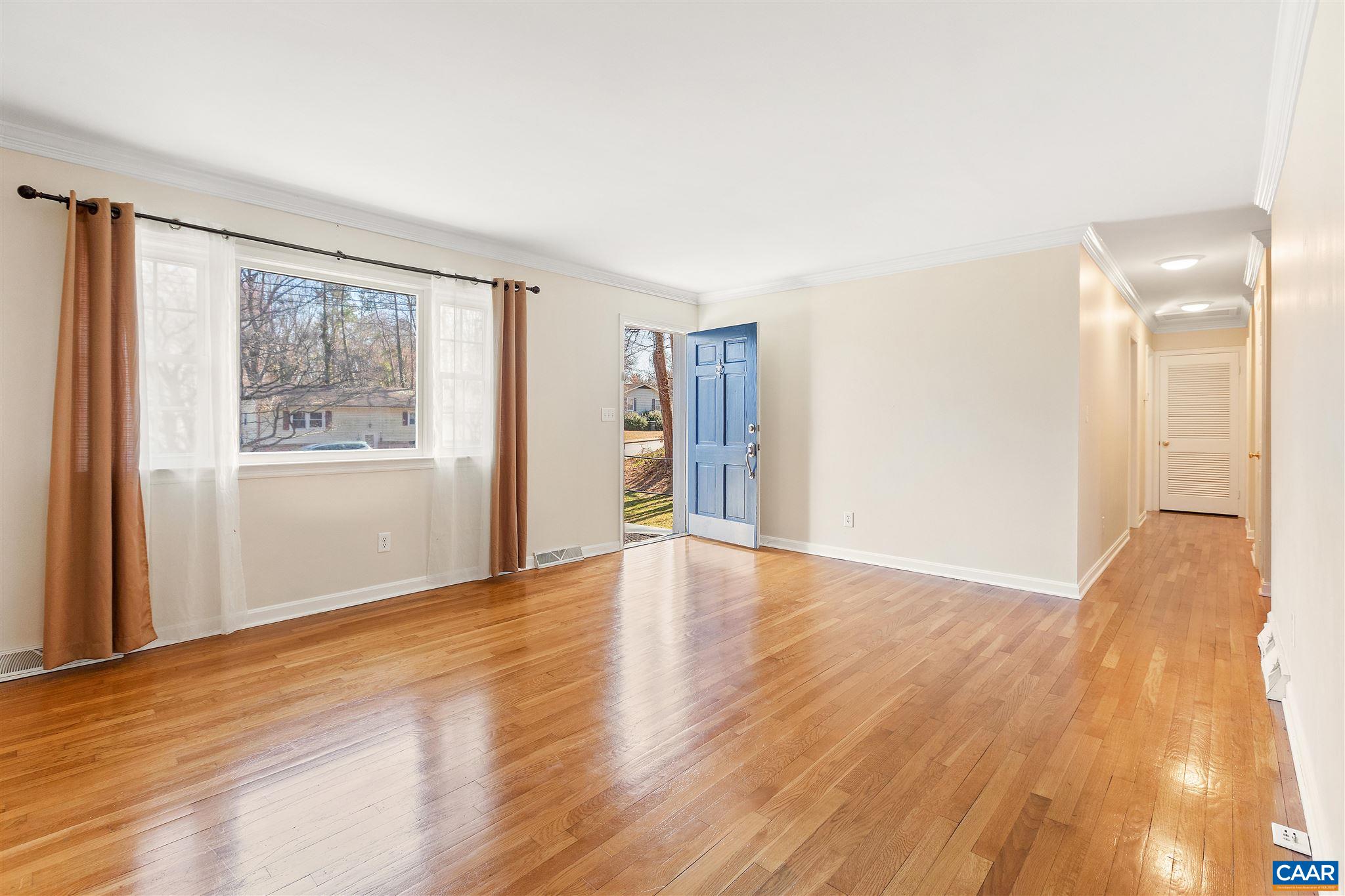 1600 Ricky Road Charlottesville, VA 22901 - Photo 4 of 34 a view of an empty room with wooden floor and a window