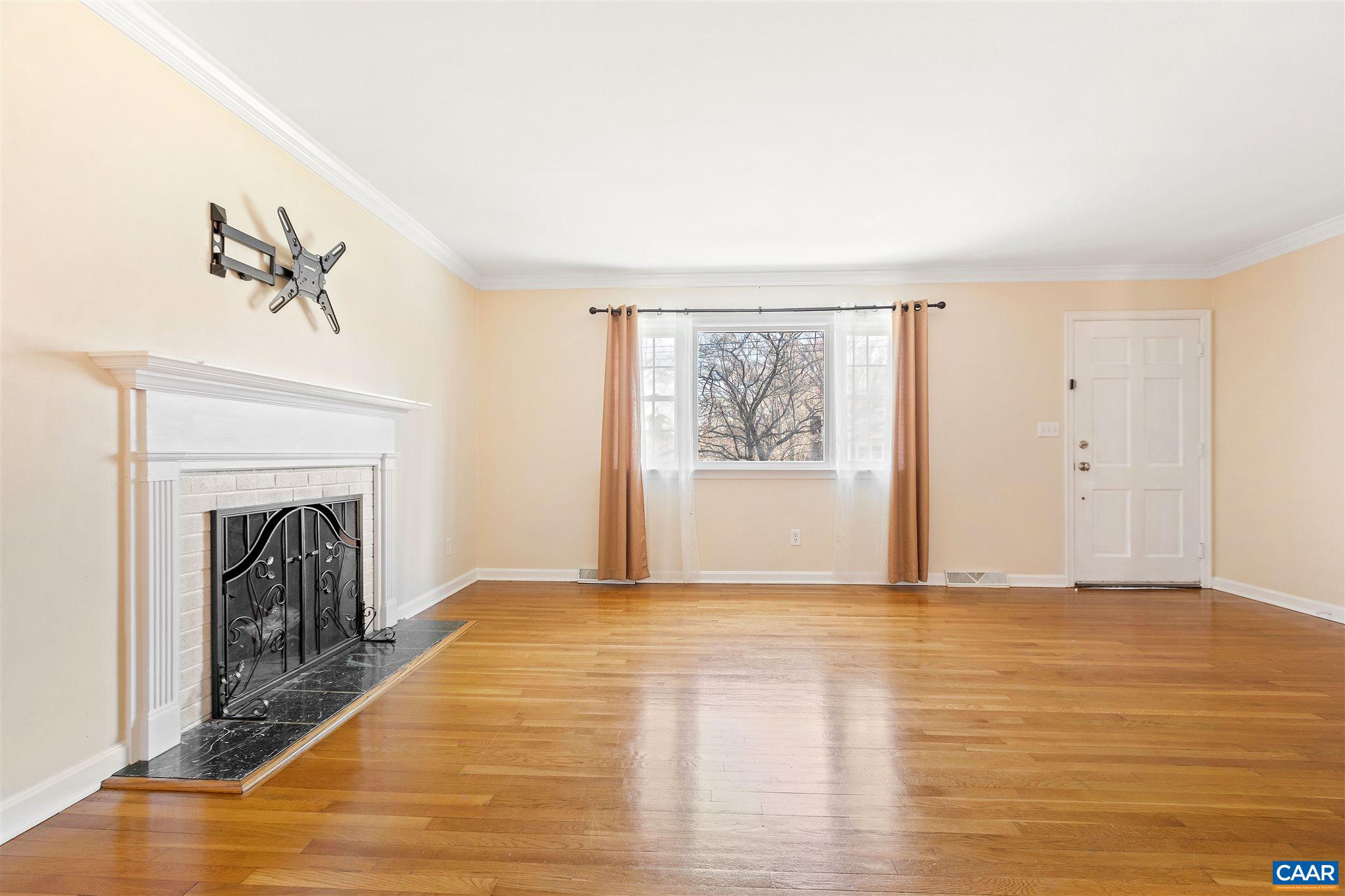 1600 Ricky Road Charlottesville, VA 22901 - Photo 5 of 34 a view of empty room with wooden floor and fireplace