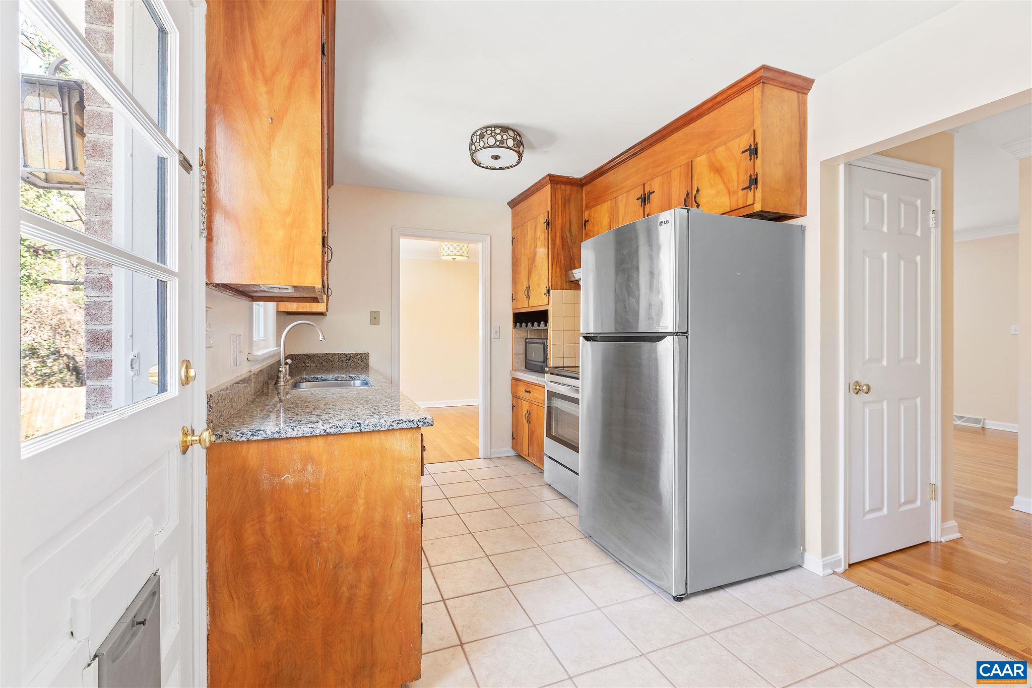 1600 Ricky Road Charlottesville, VA 22901 - Photo 10 of 34 a kitchen with stainless steel appliances granite countertop a refrigerator a stove and a sink