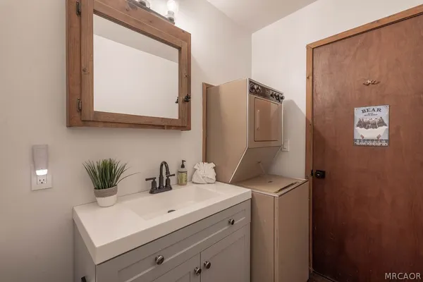 a bathroom with a sink and a mirror