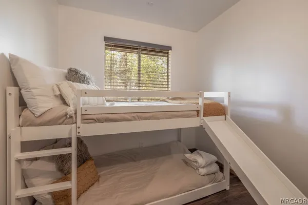 a bathroom with a bathtub and next to a window