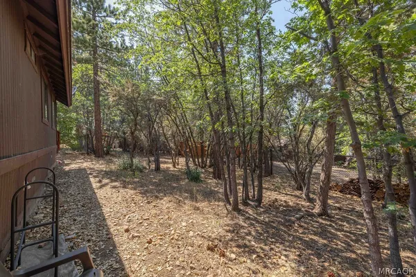 a backyard of a house with lots of green space