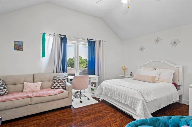 a bedroom with a bed and a couch