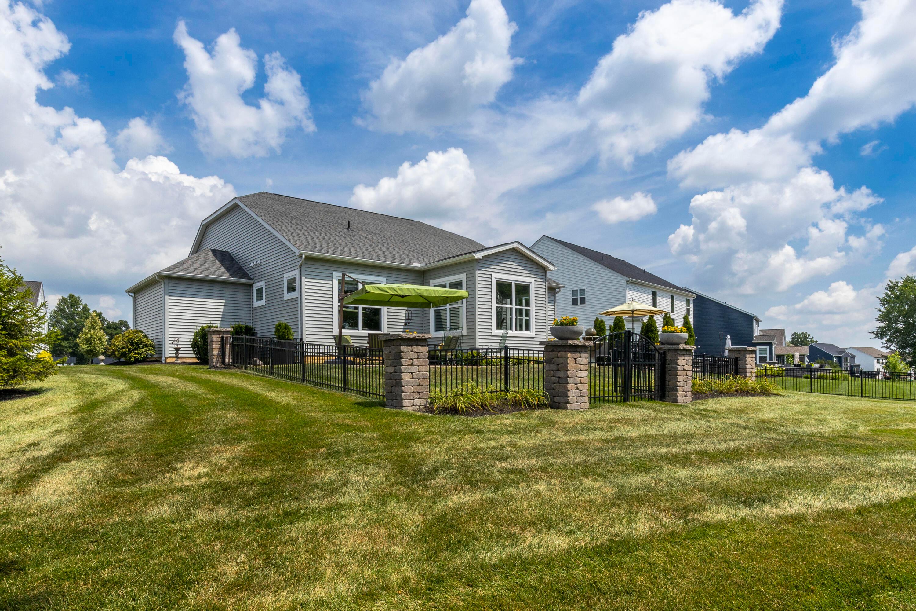 3604 Whispering Pines Road Delaware, OH 43015 - Photo 5 of 58 Rear View of lush landscaping and fencing!