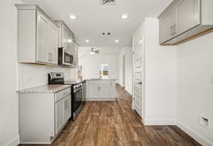 19 Greenbriar Loop Angleton, TX 77515 - Photo 15 of 19 Open-concept kitchen with a seamless flow to the living and dining areas, perfect for entertaining and daily living.