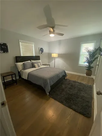 a bedroom with bed and a chandelier