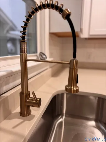 a kitchen with a sink and a window