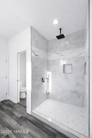 a bathroom with a glass shower door