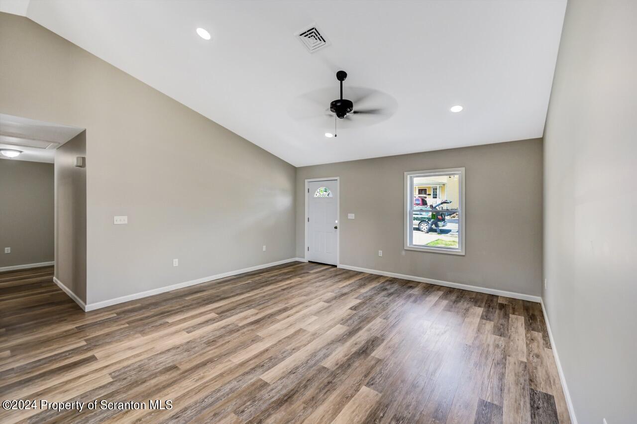 551 Back Street Scranton, PA 18504 - Photo 21 of 47 wooden floor in an empty room with a window