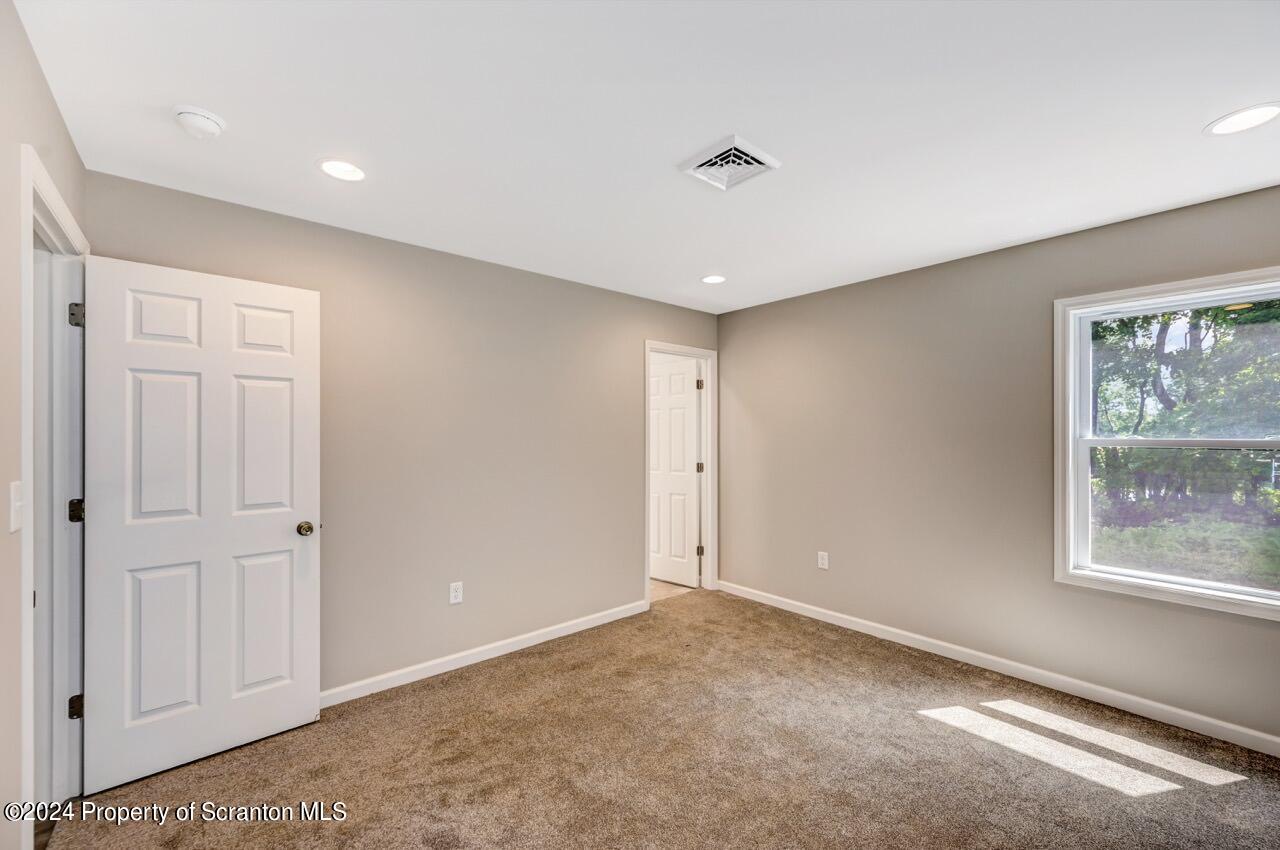 551 Back Street Scranton, PA 18504 - Photo 25 of 47 a view of an empty room with a window