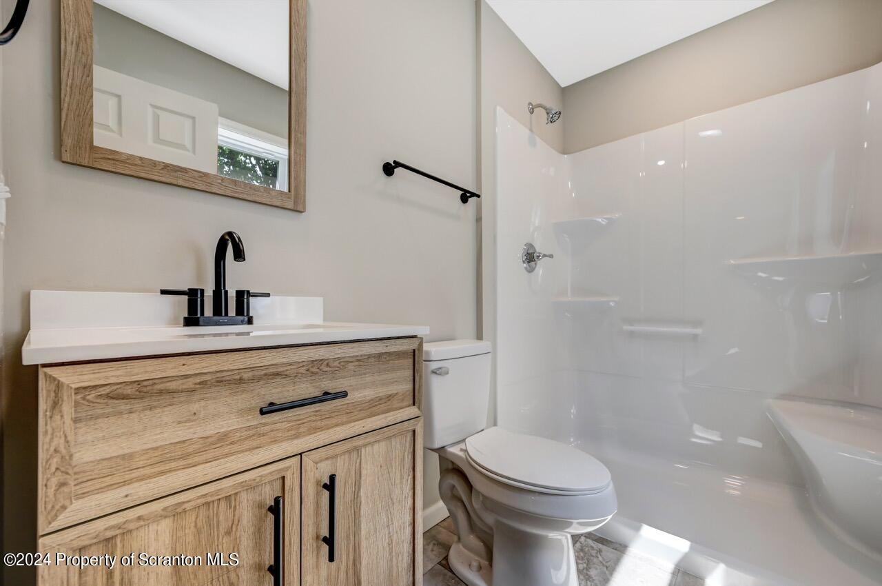 551 Back Street Scranton, PA 18504 - Photo 26 of 47 a bathroom with a sink toilet and shower