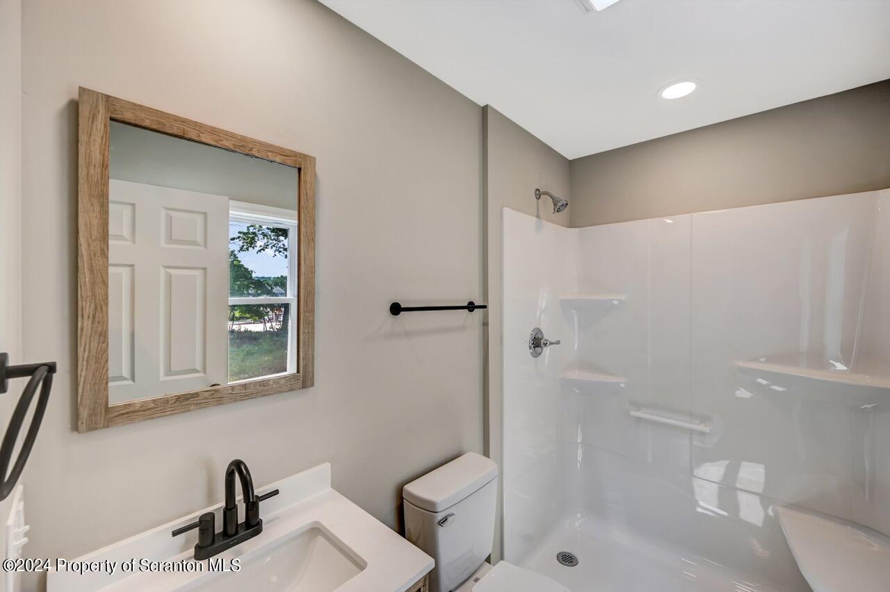 551 Back Street Scranton, PA 18504 - Photo 27 of 47 a bathroom with a sink a toilet and shower