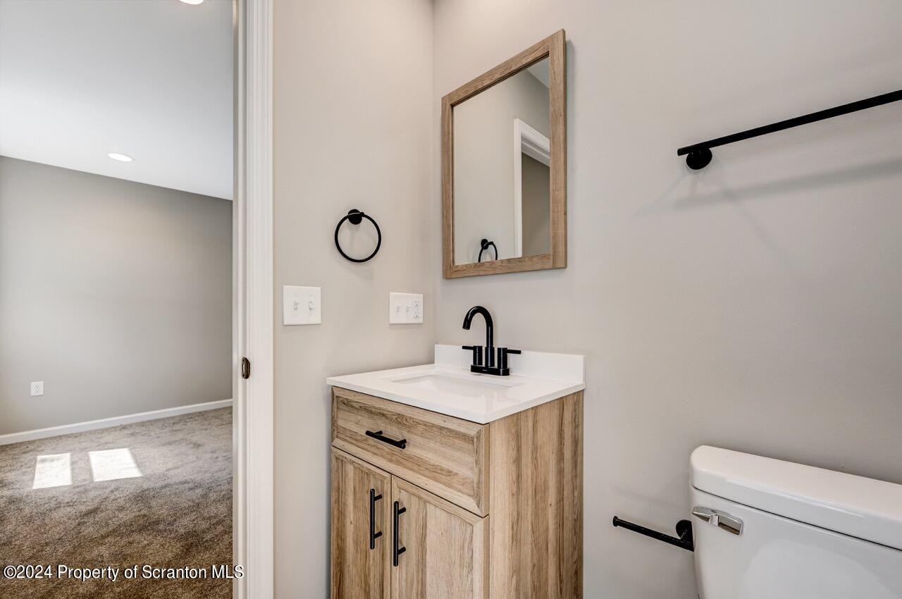 551 Back Street Scranton, PA 18504 - Photo 28 of 47 a bathroom with a sink toilet vanity and mirror
