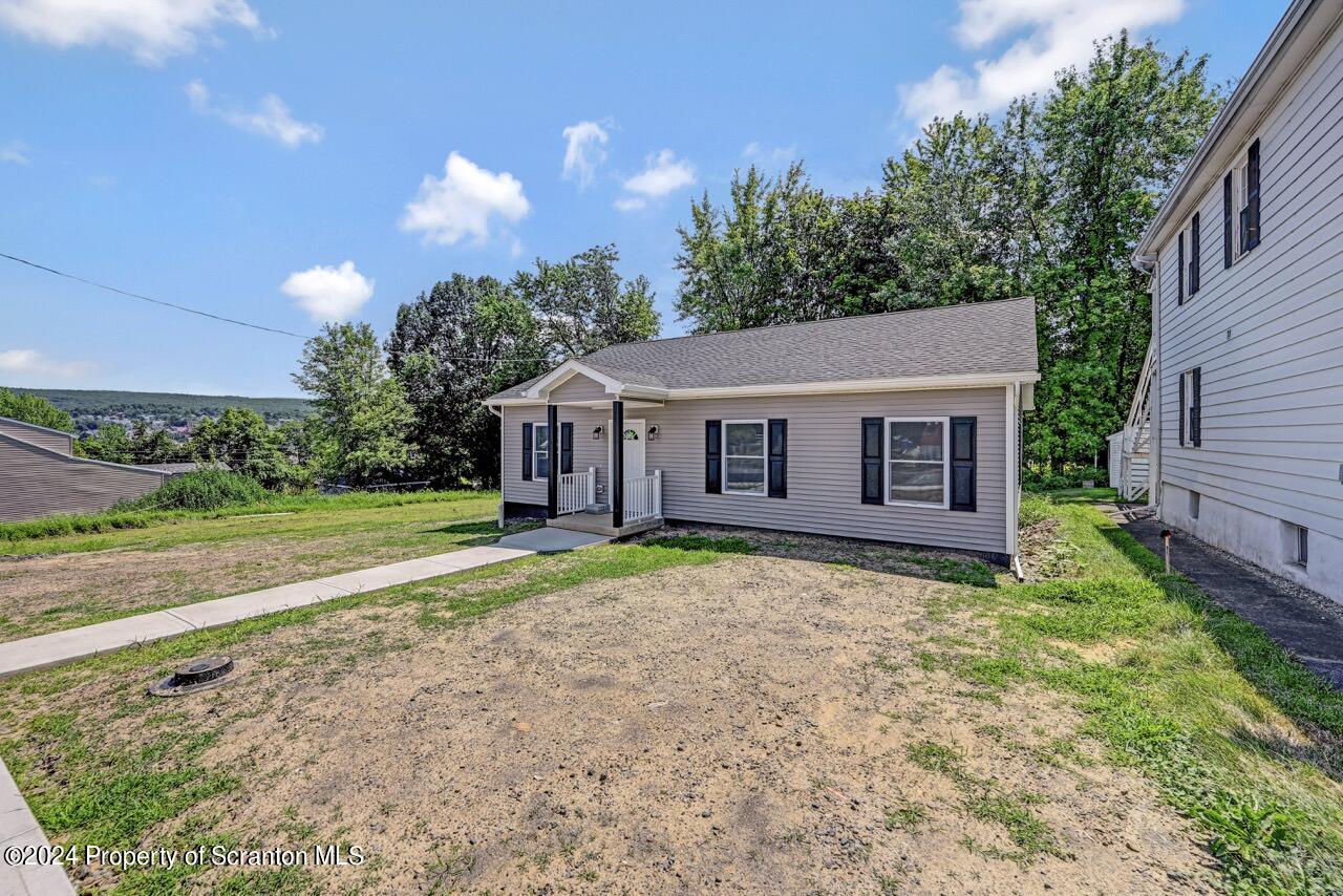 551 Back Street Scranton, PA 18504 - Photo 3 of 47 a view of a house with backyard and garden