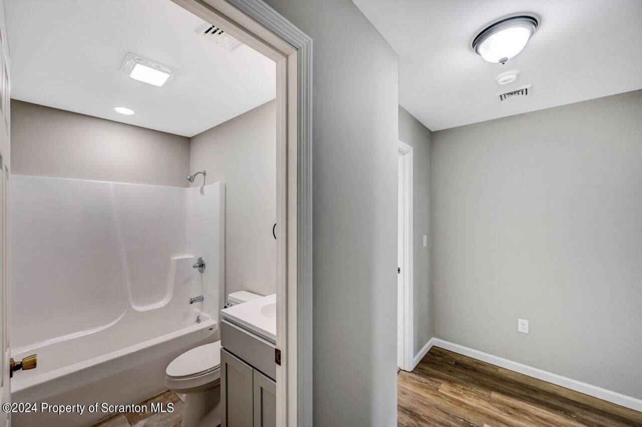551 Back Street Scranton, PA 18504 - Photo 33 of 47 a bathroom with a sink a toilet and shower