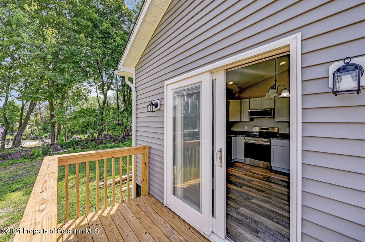 551 Back Street Scranton, PA 18504 - Photo 42 of 47 a view of a balcony with wooden floor and fence