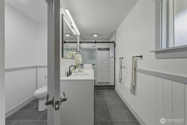 a kitchen with a refrigerator and a sink