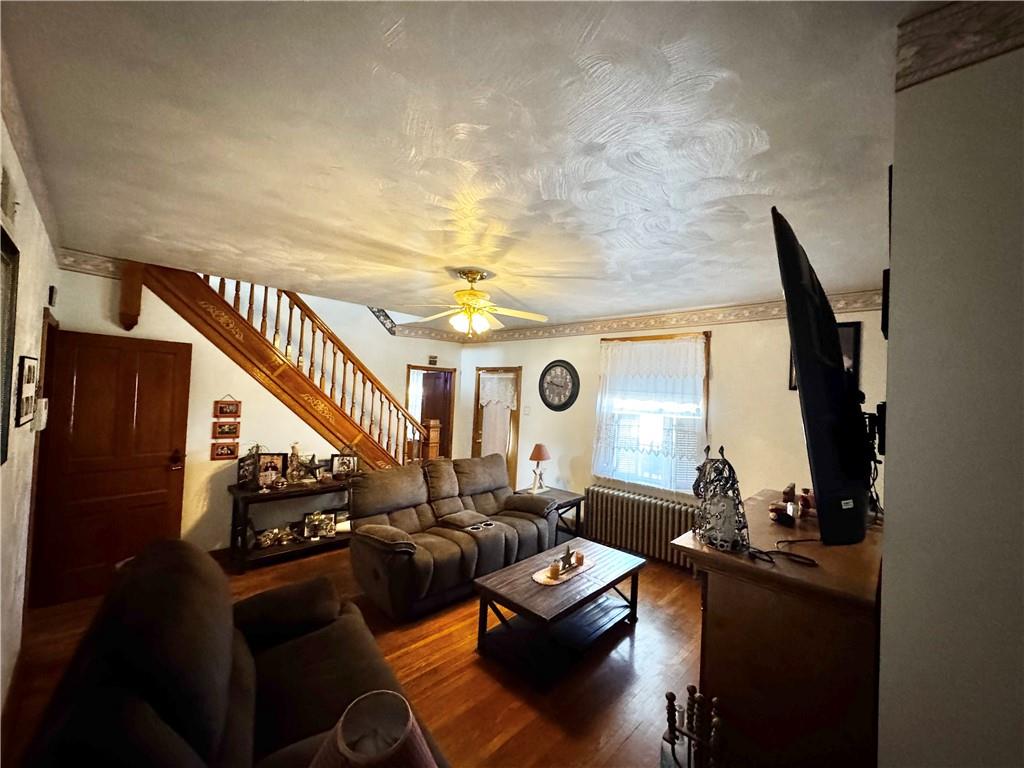 211 Stephens Street Vanderbilt, PA 15486 - Photo 14 of 48 a living room with couches and furniture with wooden floor