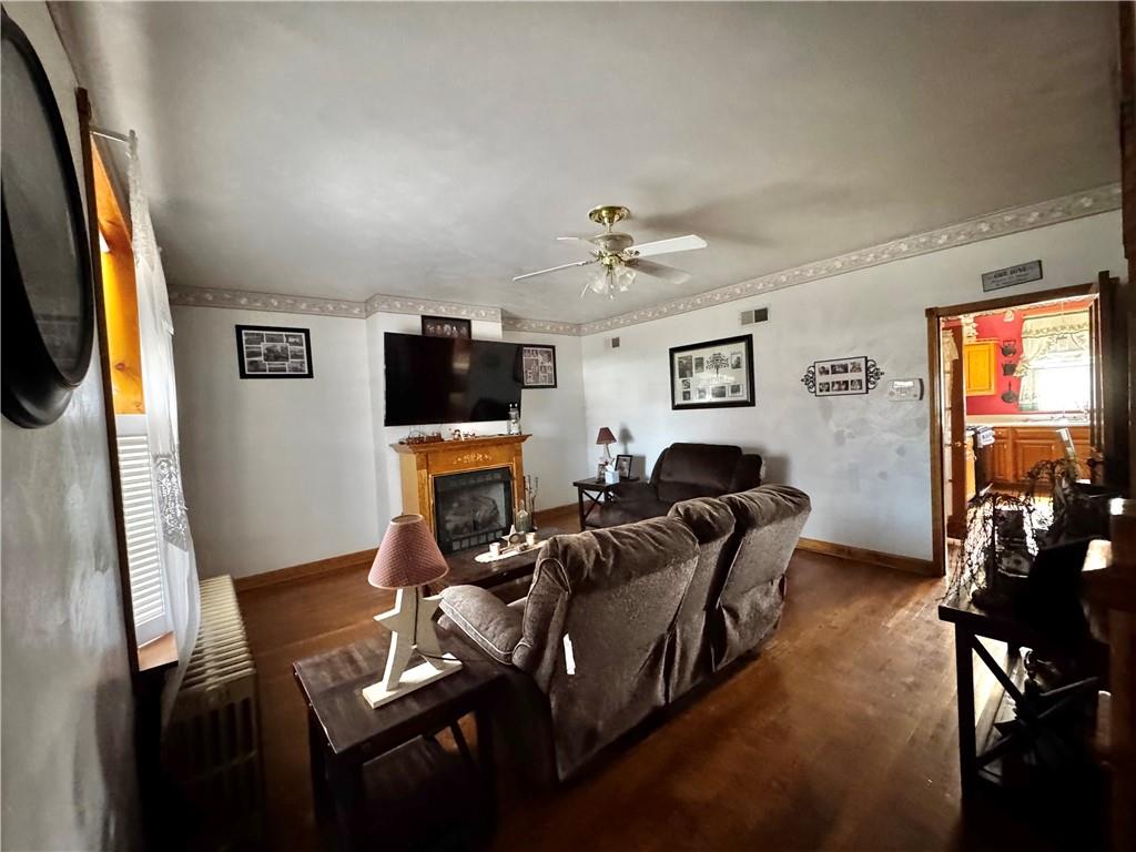 211 Stephens Street Vanderbilt, PA 15486 - Photo 16 of 48 a living room with furniture and a flat screen tv