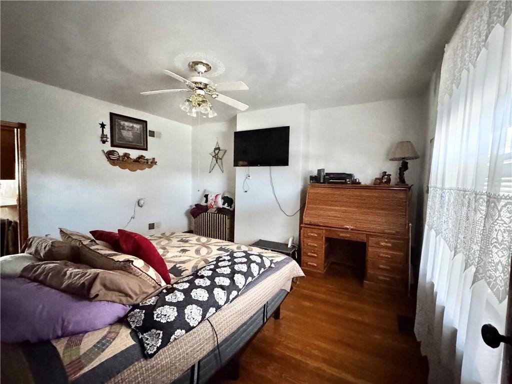 211 Stephens Street Vanderbilt, PA 15486 - Photo 24 of 48 a bedroom with a bed and flat screen tv