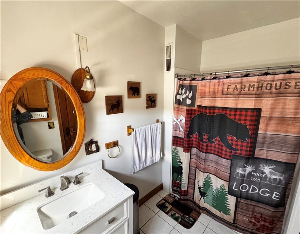 211 Stephens Street Vanderbilt, PA 15486 - Photo 25 of 48 a bathroom with a sink and a mirror