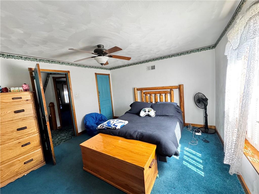 211 Stephens Street Vanderbilt, PA 15486 - Photo 30 of 48 a bedroom with a bed and a window