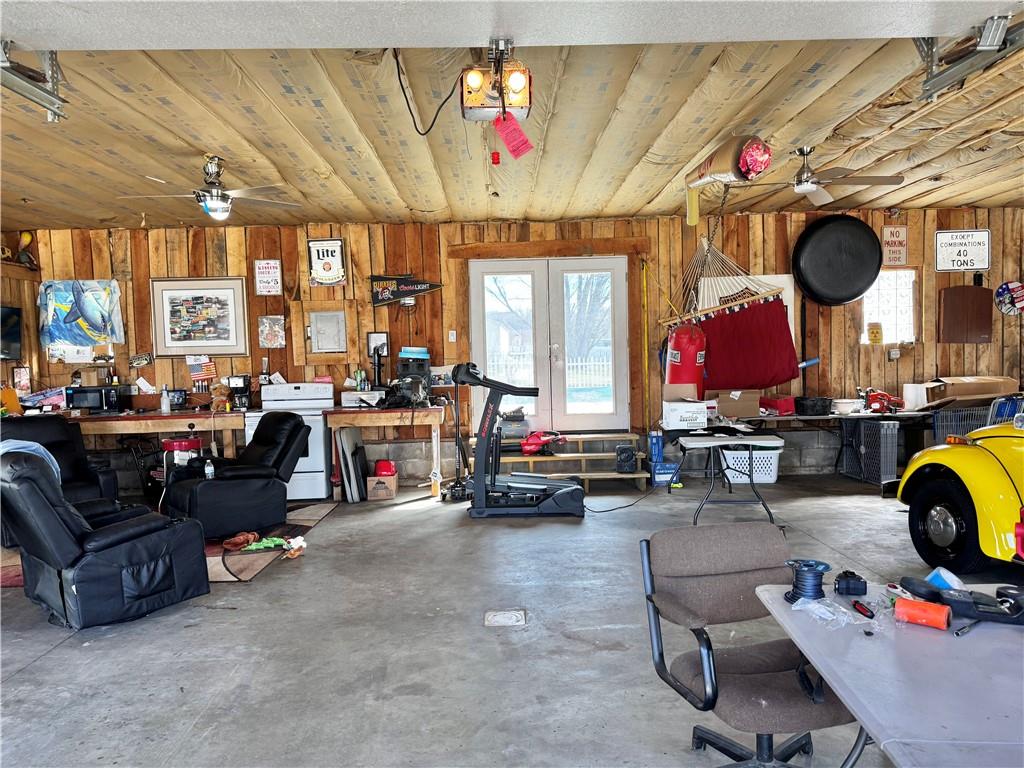 211 Stephens Street Vanderbilt, PA 15486 - Photo 46 of 48 a living room with furniture a fireplace and chandelier