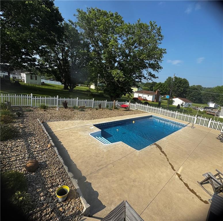 211 Stephens Street Vanderbilt, PA 15486 - Photo 6 of 48 a view of a swimming pool with an outdoor seating and a pathway
