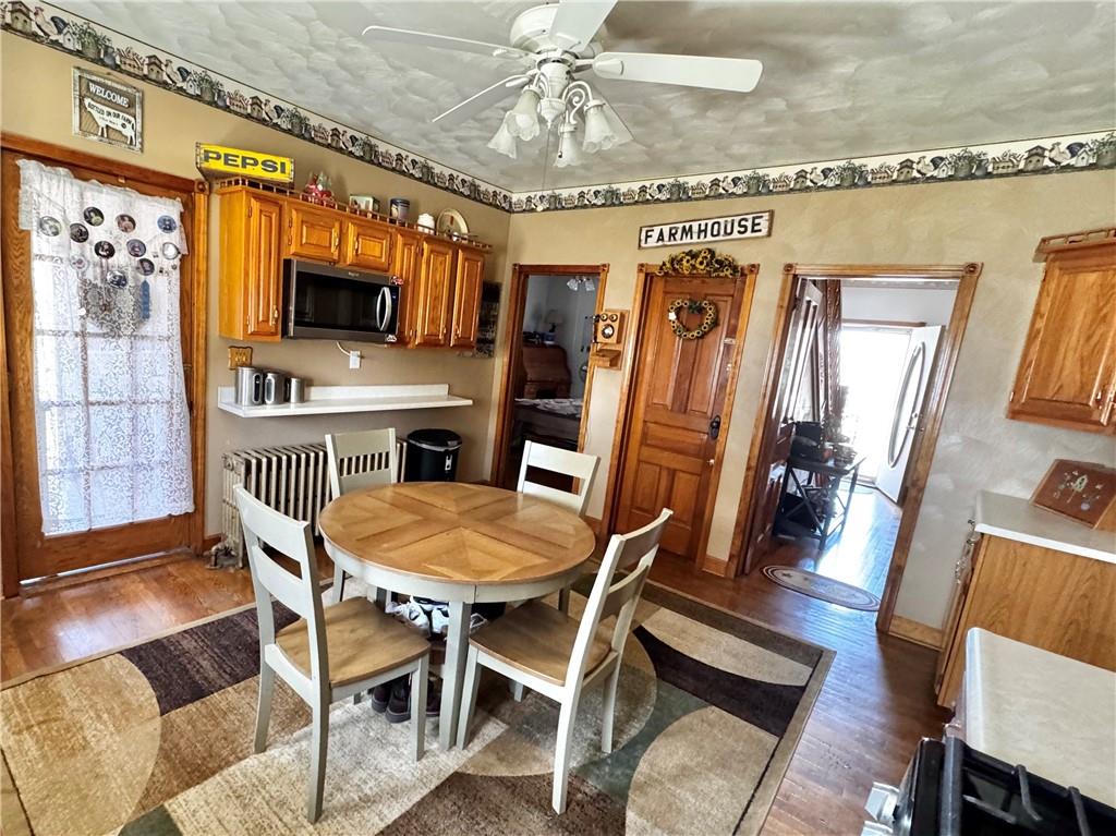 211 Stephens Street Vanderbilt, PA 15486 - Photo 9 of 48 a view of a dining room with furniture wooden floor and chandelier