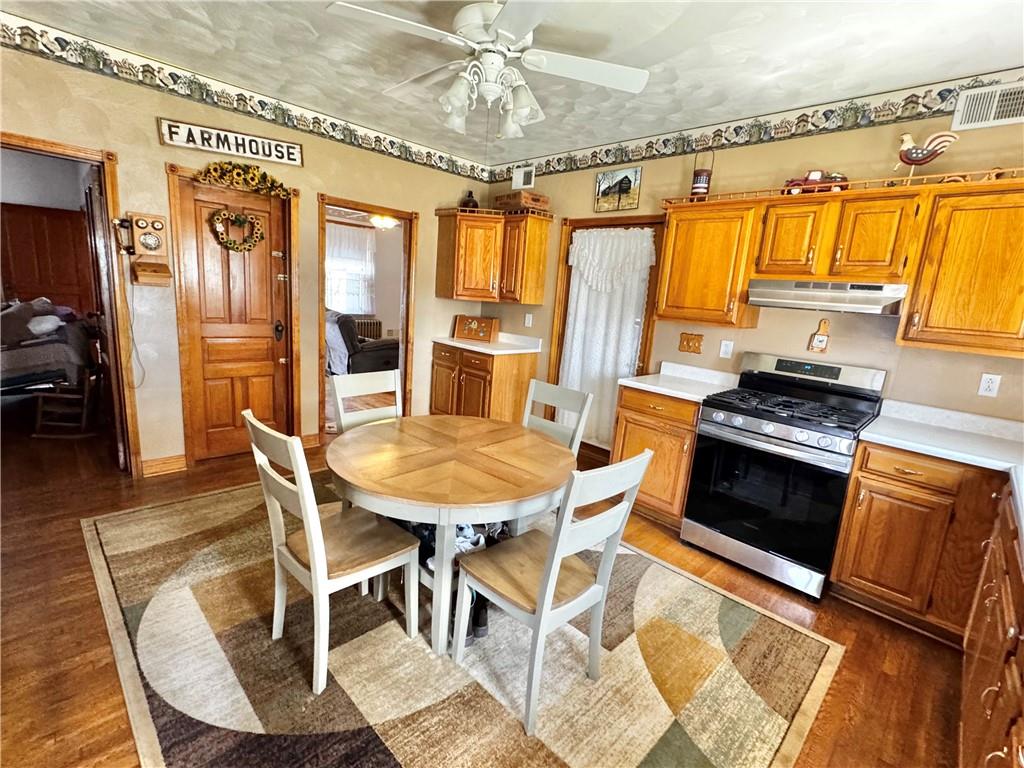 211 Stephens Street Vanderbilt, PA 15486 - Photo 10 of 48 a view of a dining room with furniture window and wooden floor