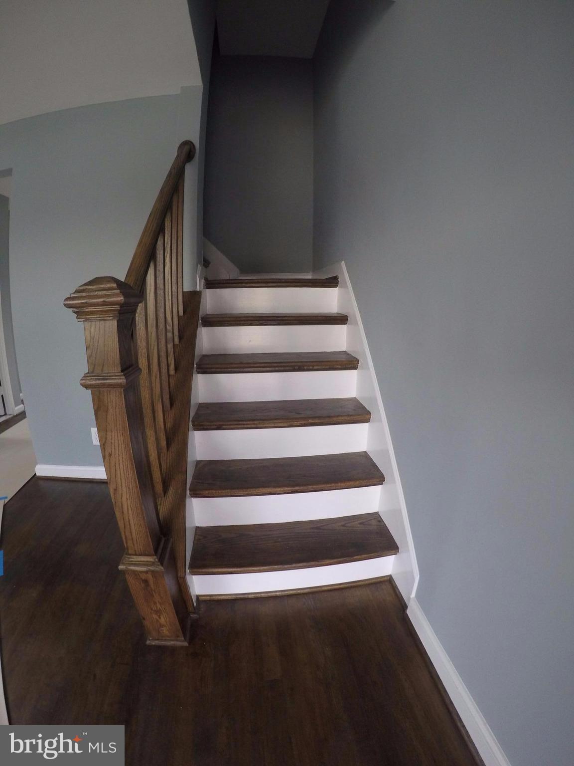7468 Rabon Avenue Baltimore, MD 21222 - Photo 4 of 16 Gorgeous Oak Refinished Flooring & Railing