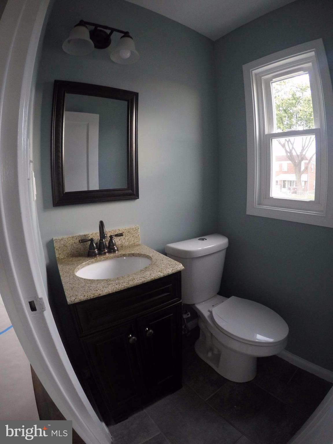 7468 Rabon Avenue Baltimore, MD 21222 - Photo 7 of 16 Designer Powder Room on Main Level w/Tile Flooring