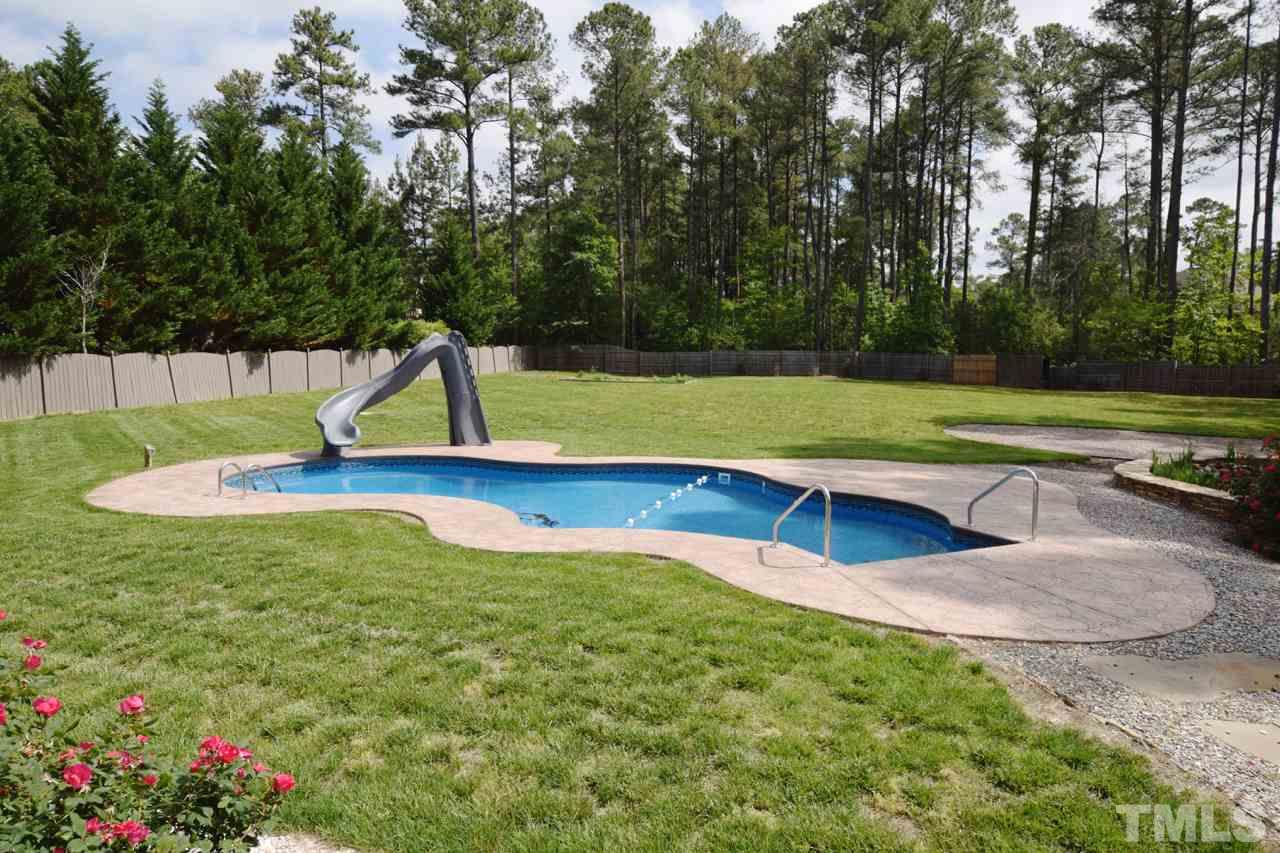 10320 Old Creedmoor Road Raleigh, NC 27613 - Photo 6 of 25 a view of pool with a yard and trees