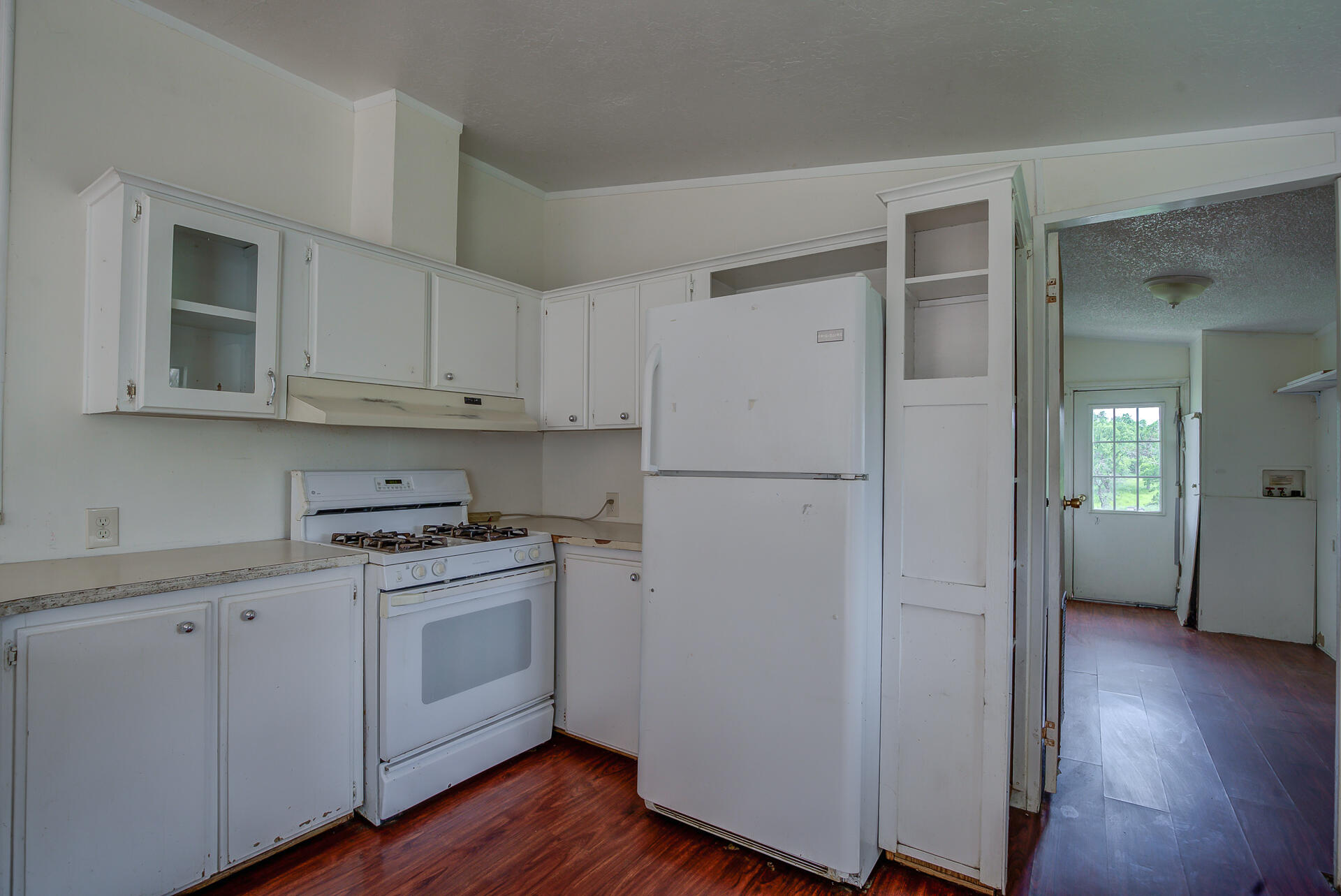 4450 Locust Road Anderson, CA 96007 - Photo 13 of 40 a kitchen with stainless steel appliances a refrigerator sink and cabinets