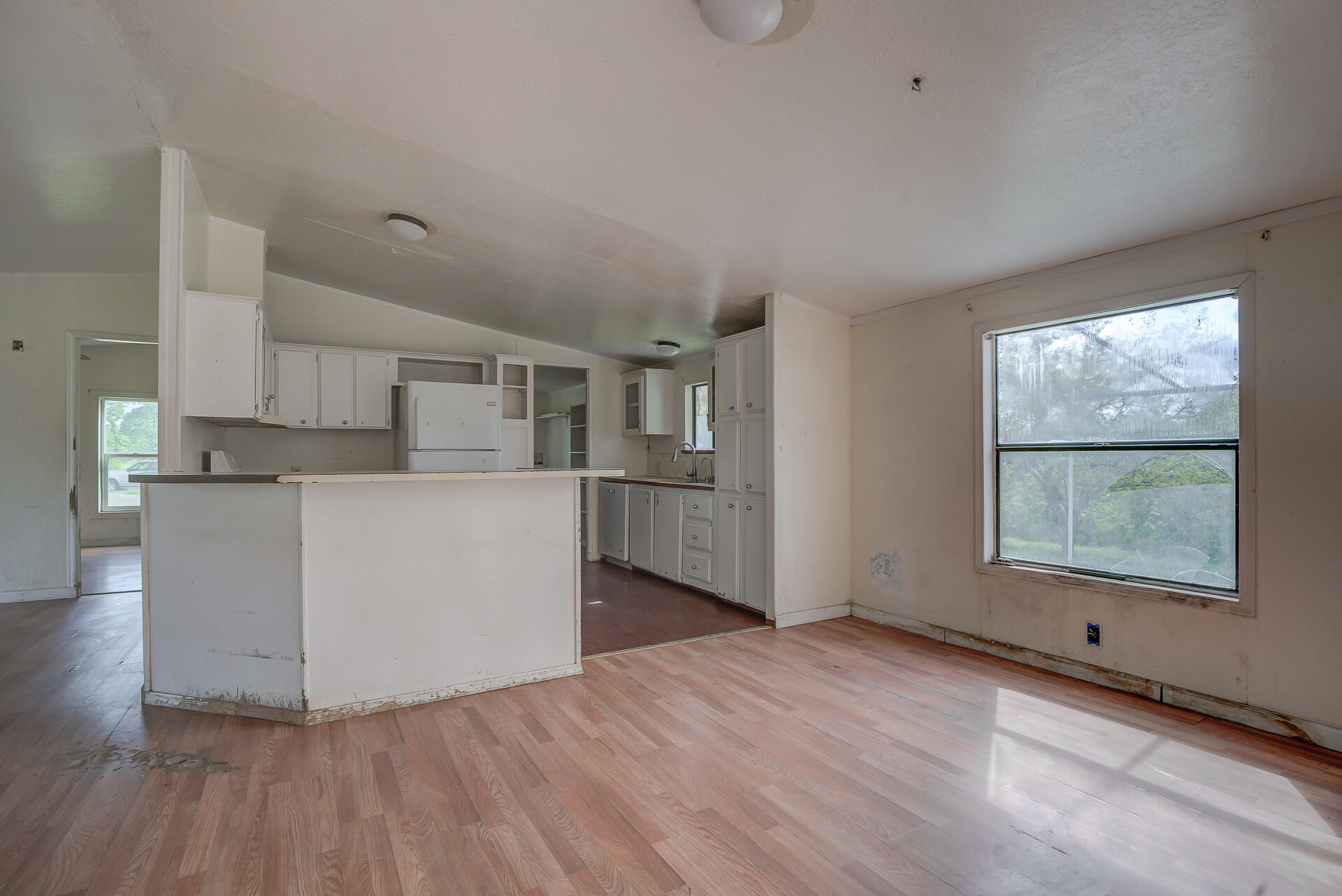 4450 Locust Road Anderson, CA 96007 - Photo 15 of 40 a view of a kitchen with wooden floor and electronic appliances