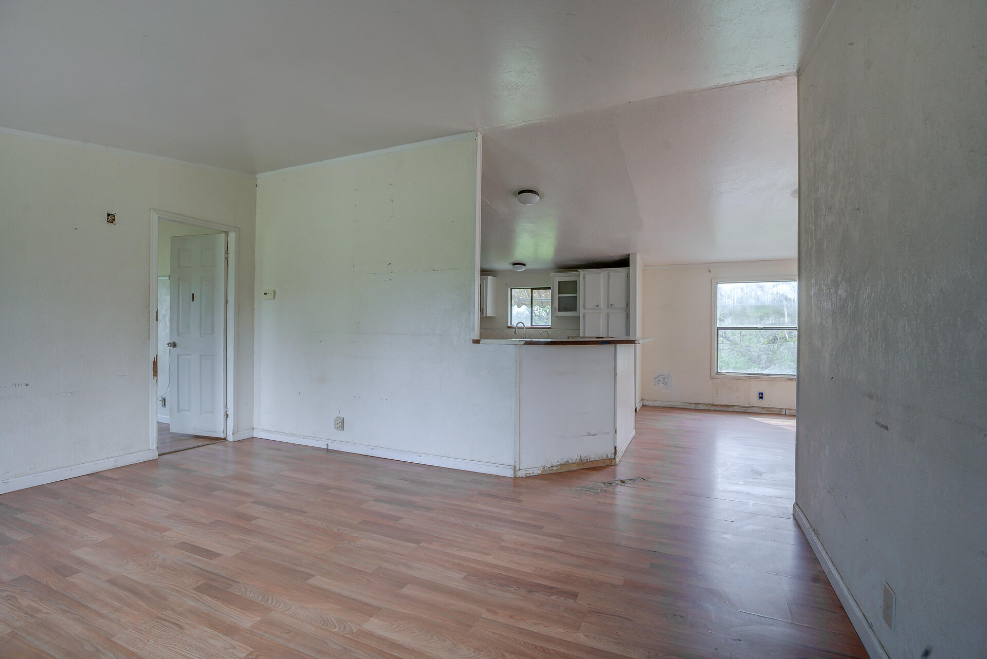 4450 Locust Road Anderson, CA 96007 - Photo 17 of 40 a view of a kitchen with wooden floor and a window