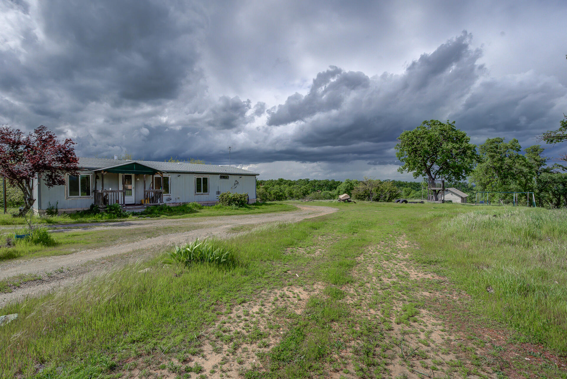 4450 Locust Road Anderson, CA 96007 - Photo 2 of 40 a front view of house with yard and green space