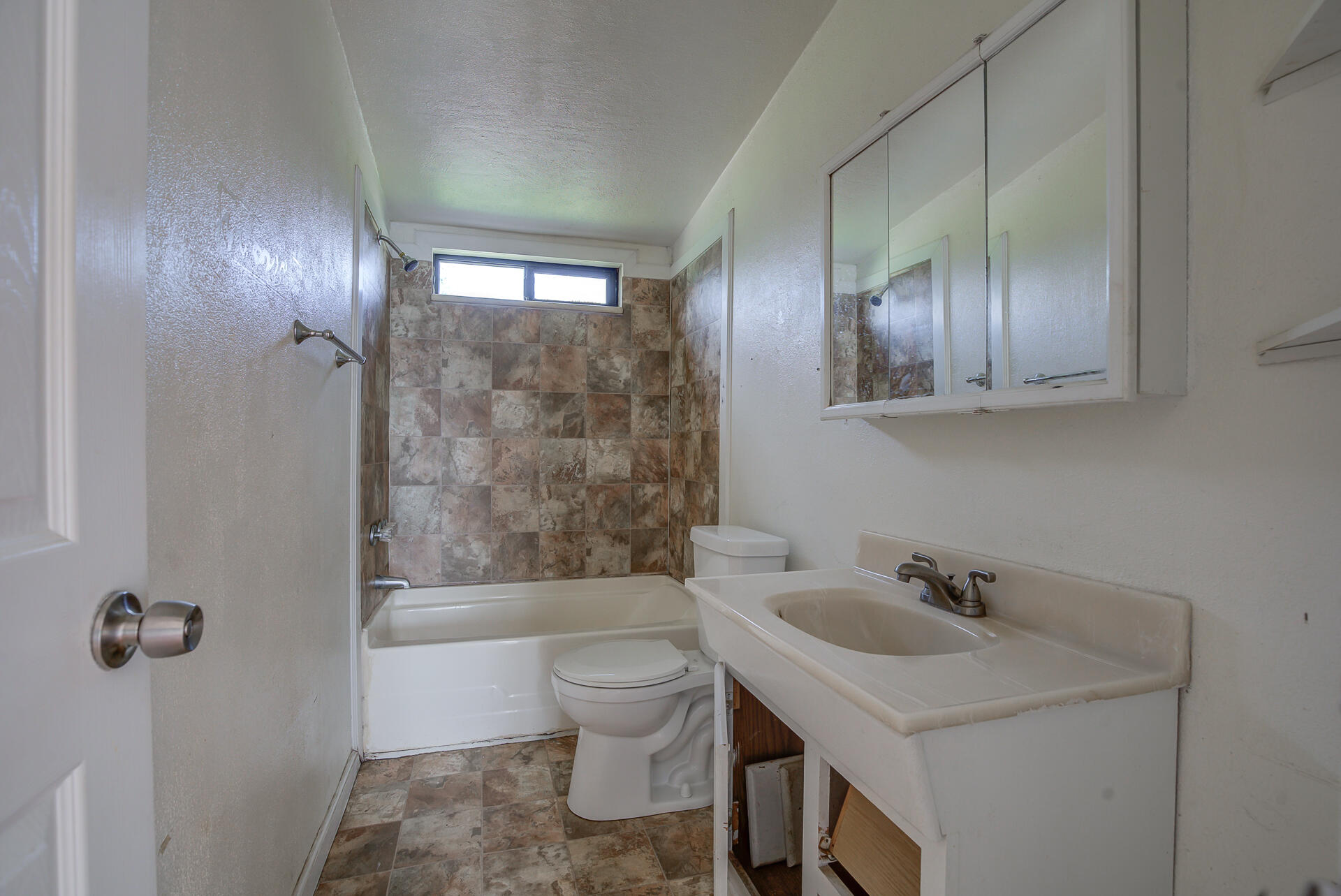 4450 Locust Road Anderson, CA 96007 - Photo 25 of 40 a bathroom with a sink a toilet and shower