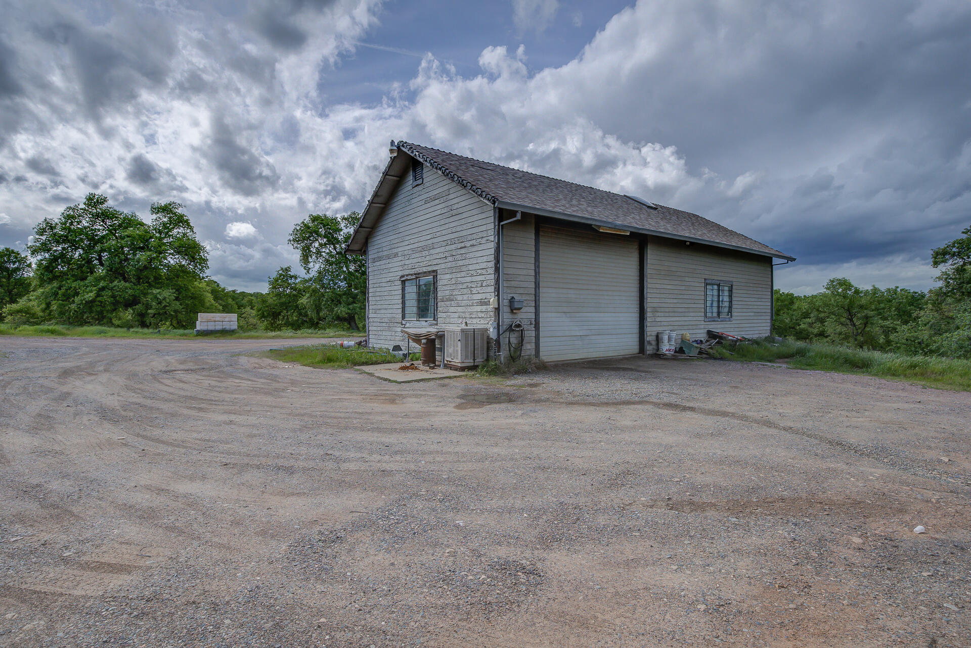 4450 Locust Road Anderson, CA 96007 - Photo 33 of 40 a view of a house with backyard and bushes