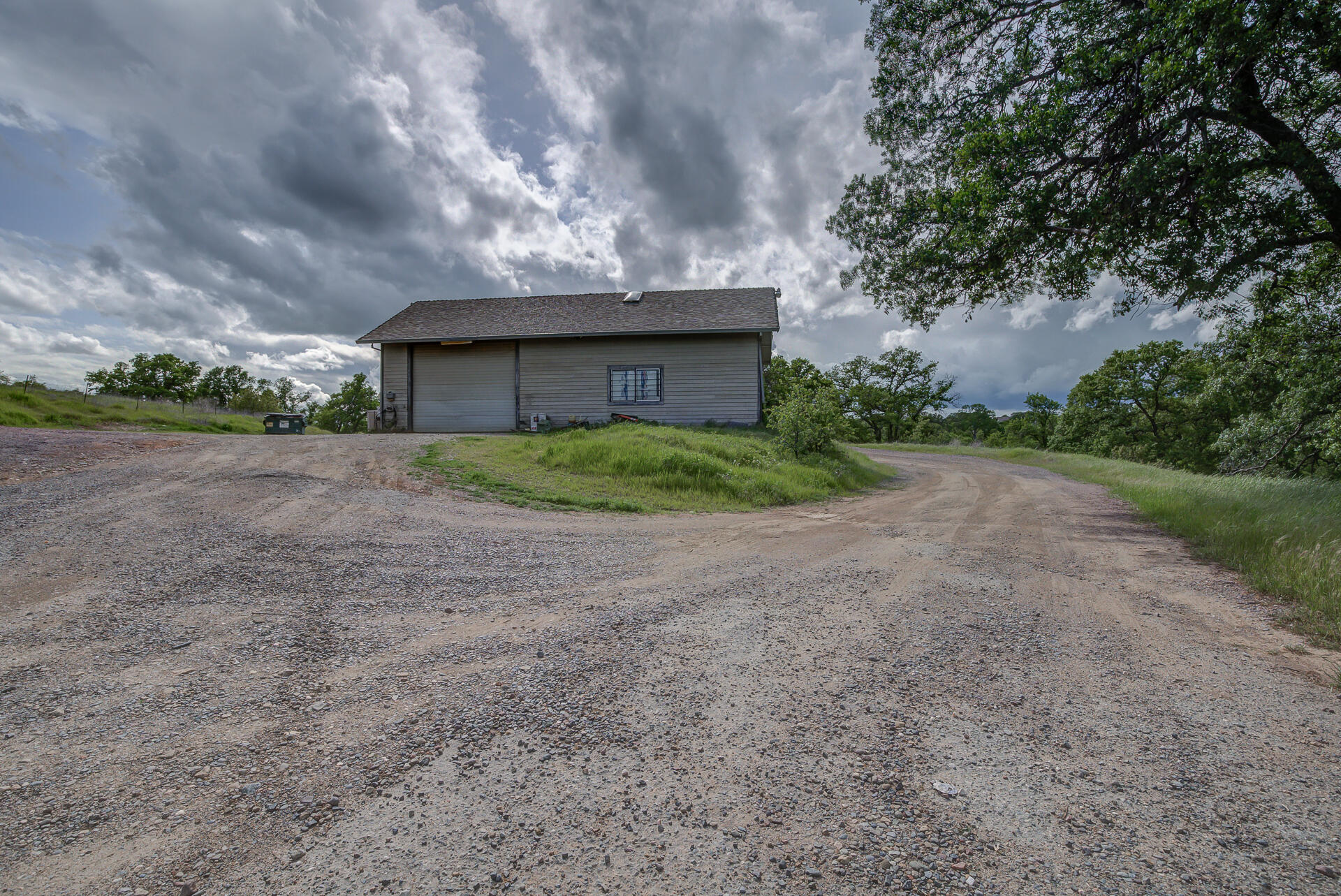 4450 Locust Road Anderson, CA 96007 - Photo 34 of 40 a view of a house with a yard and garage