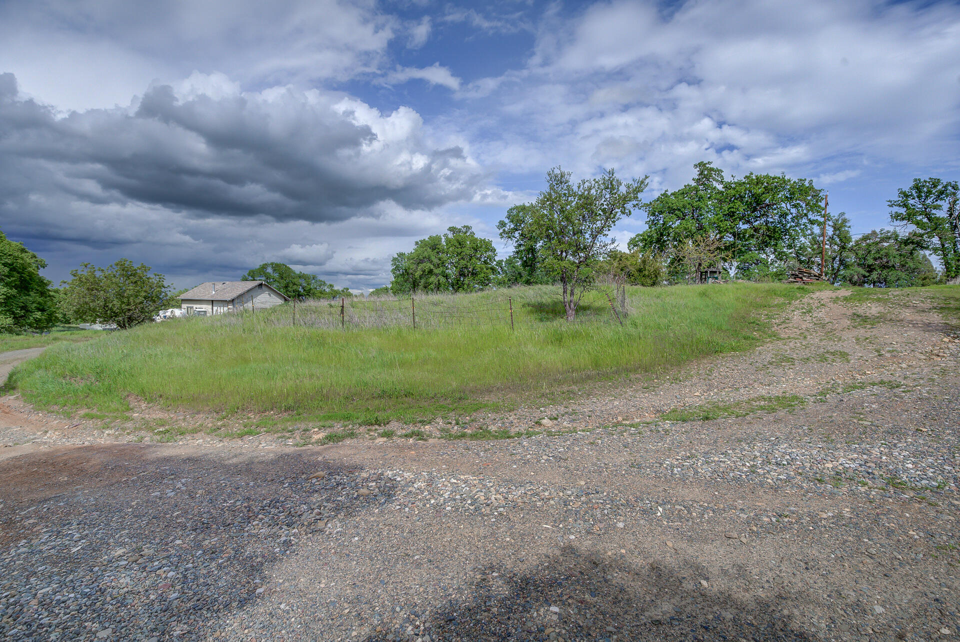 4450 Locust Road Anderson, CA 96007 - Photo 9 of 40 a view of a field with trees in background