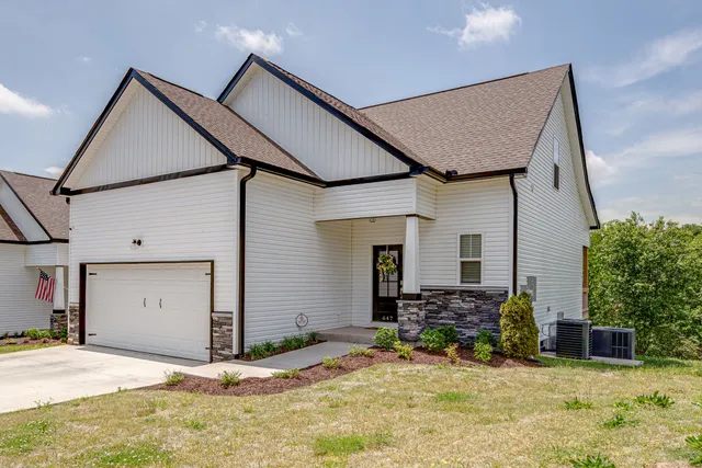 a view of house with yard