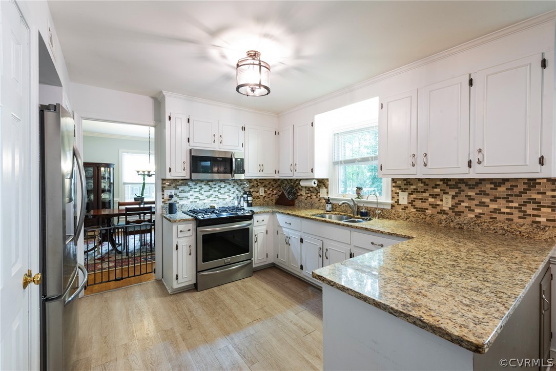 13810 Shadow Ridge Road Midlothian, VA 23112 - Photo 11 of 40 a kitchen with stainless steel appliances granite countertop a stove oven and a white cabinets