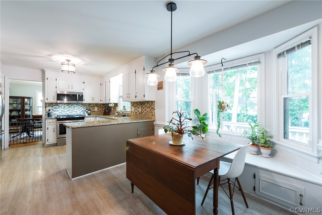 13810 Shadow Ridge Road Midlothian, VA 23112 - Photo 15 of 40 a kitchen with kitchen island a large counter top space and stainless steel appliances
