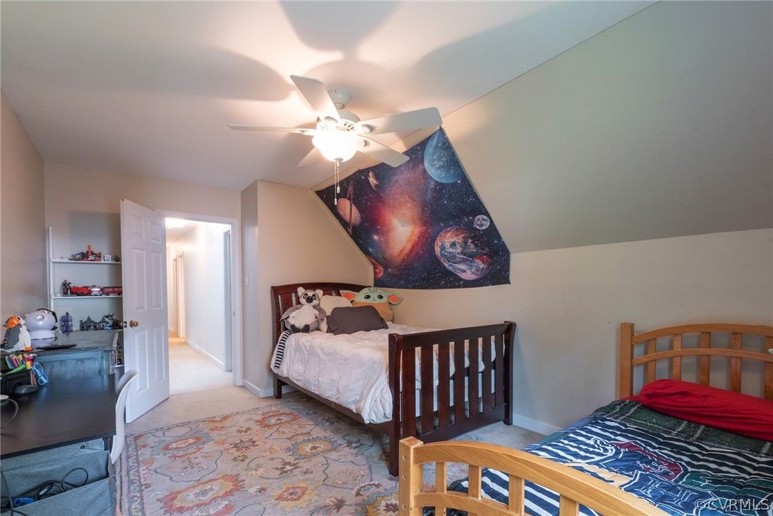 13810 Shadow Ridge Road Midlothian, VA 23112 - Photo 24 of 40 a bedroom with a bed and wooden floor