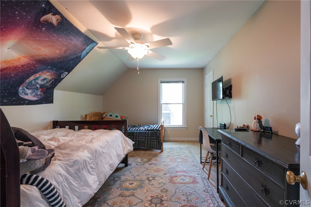 13810 Shadow Ridge Road Midlothian, VA 23112 - Photo 25 of 40 a bedroom with a bed and a chandelier