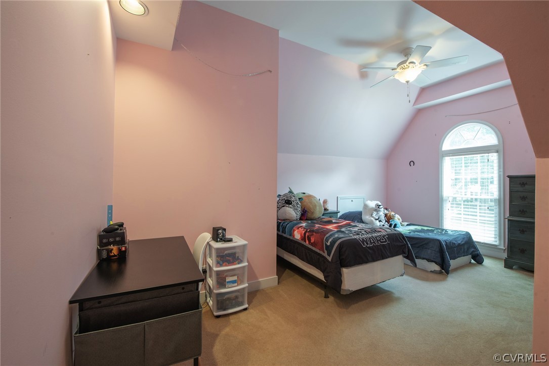 13810 Shadow Ridge Road Midlothian, VA 23112 - Photo 27 of 40 a bedroom with a bed and a chandelier