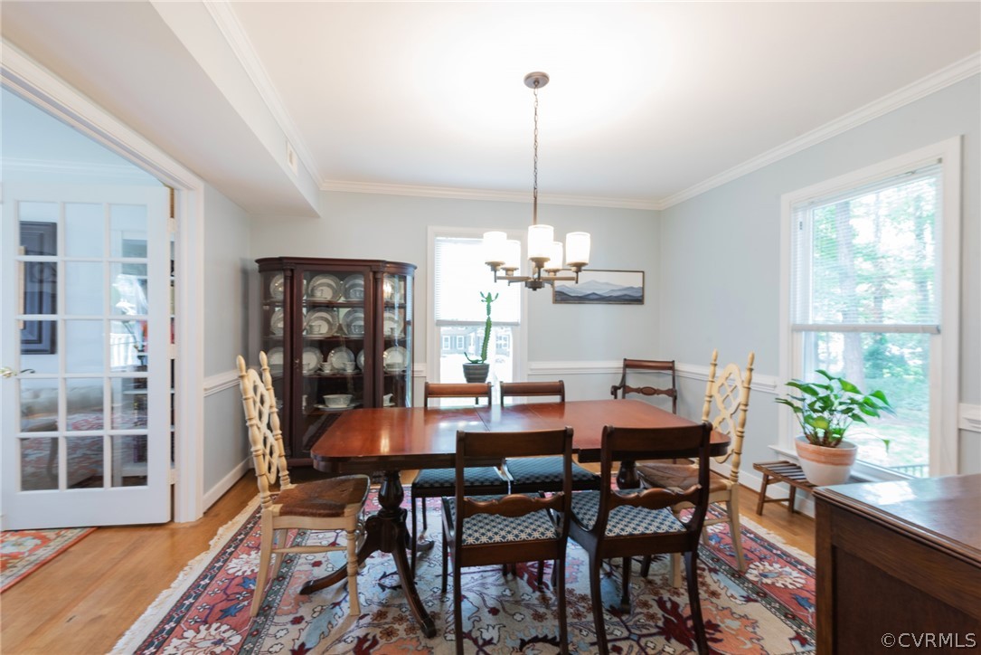 13810 Shadow Ridge Road Midlothian, VA 23112 - Photo 8 of 40 a view of a dining room with furniture window and wooden floor