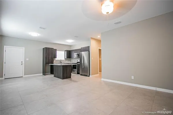 a bathroom with a granite countertop sink a toilet and bathtub