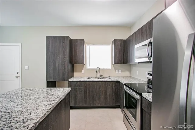 a view of a kitchen with a sink